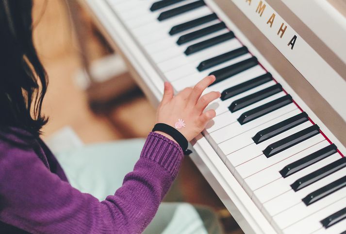 Student playing the piano